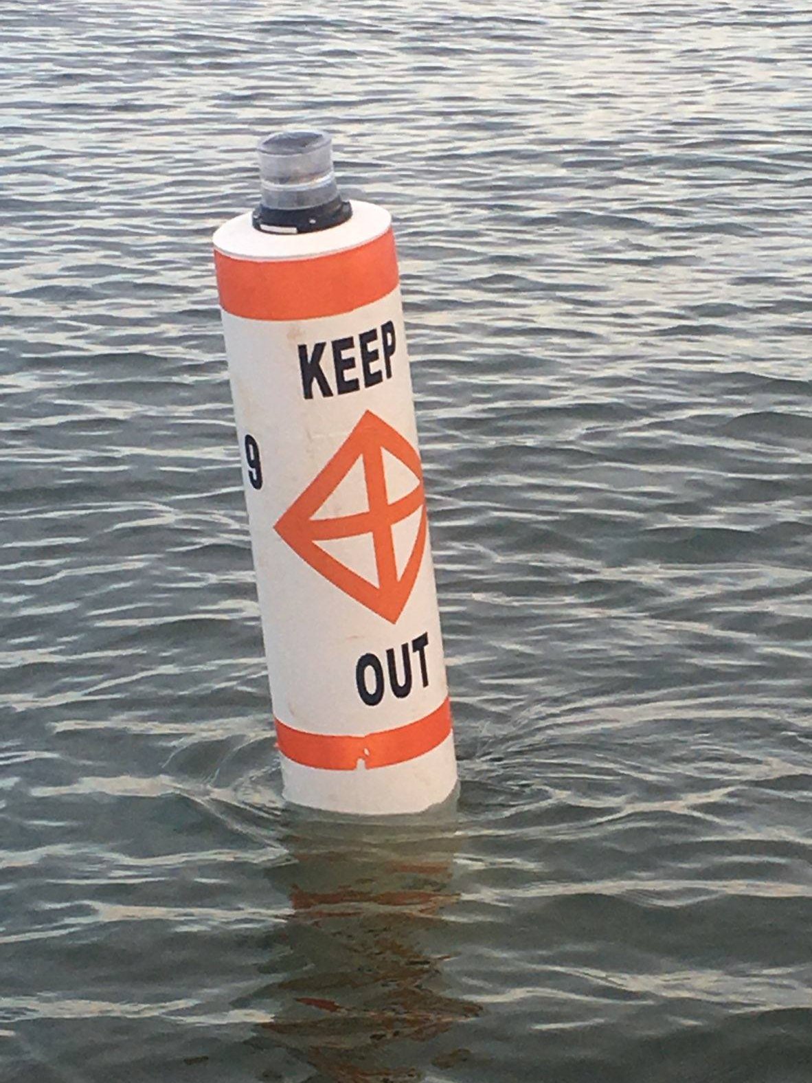You See a White Buoy with an Orange Square and Black Lettering: Decoding Navigational Markers